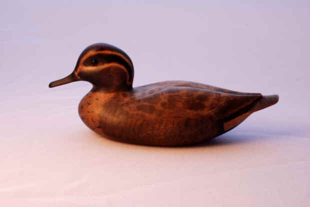 Teal bird carving